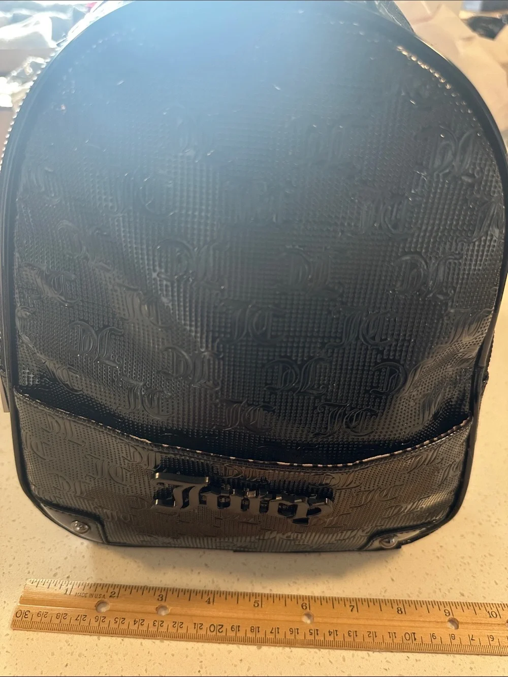 Juicy Couture Black Patent Mini Backpack, new without tags. Excellent condition.